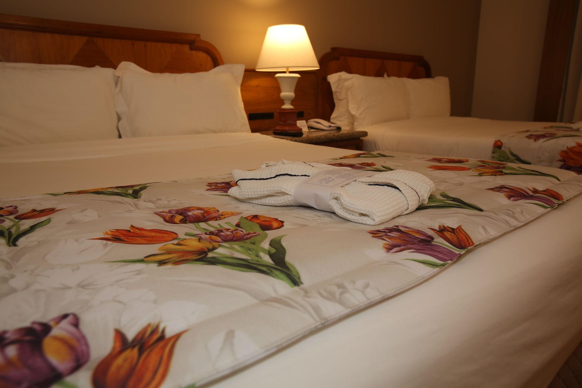 Mabu Thermas Grand Resort Foz do Iguacu Bagian luar foto A bed with a duvet